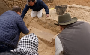 Josh Gates explores an Expedition Unknown hidden tomb beneath Egypt's ancient cemetery.