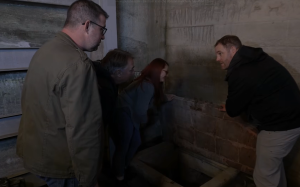 Josh Gates crawls into a hidden bootlegger tunnel beneath a historic distillery.