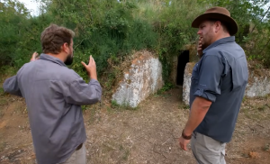 Josh Gates explores an ancient Etruscan family tomb carved into an Italian hillside.